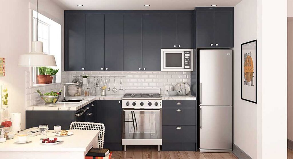 Compact kitchen featuring dark blue cabinets, stainless steel appliances, and a white subway tile backsplash.