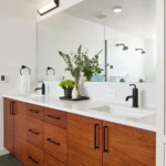 Modern double vanity with wood cabinets and black fixtures