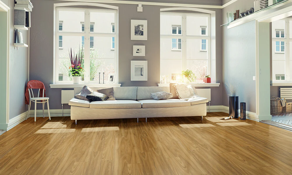 Bright living room with natural oak vinyl flooring, light sofa, and large windows.