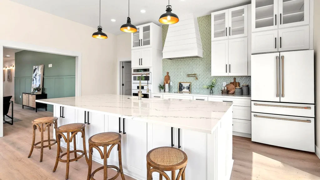 Modern kitchen with bright white shaker cabinets, marble waterfall island, and natural wood stools