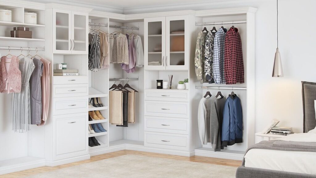 White walk-in closet with hanging sections, drawers, shoe racks, and glass cabinet doors