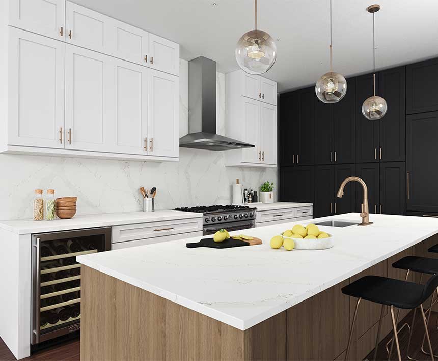 Modern kitchen with white marble countertops, two-tone cabinetry, and pendant lighting.