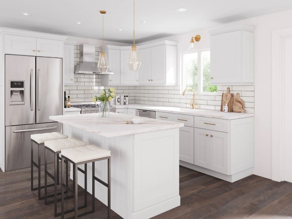 Modern kitchen featuring white Aspen shaker cabinets, marble countertops, and stainless steel appliances